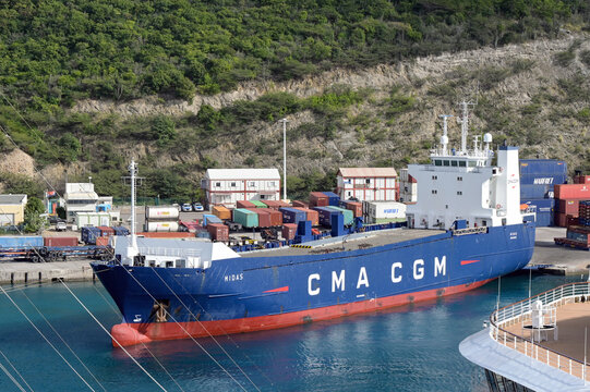 Philipsburg, St Maarten, Netherlands Antilles - 17 January 2026: Cargo ship Midas docked in the port of Philipsburg. It is operated by the CMA CGM shipping company.