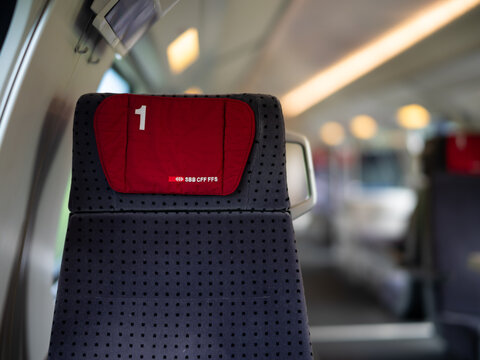 LAUSANNE, SWITZERLAND &ndash; JULY 3, 2023: Close-up of a modern Swiss Federal Railways (SBB CFF FFS) train seat with visible branding inside a passenger carriage