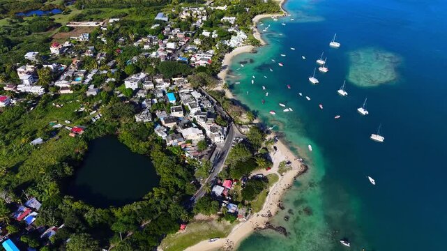 Scenic aerial drone video of the Trou d`Eau Douce resort, Mauritius, Africa. Indian ocean coral reef landscape	
