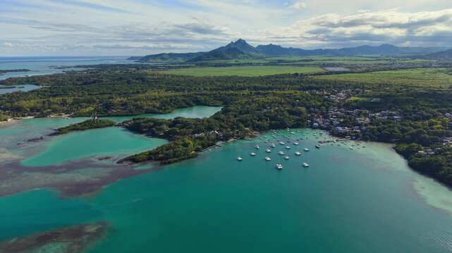Scenic aerial drone video of the Trou d`Eau Douce resort, Mauritius, Africa. Indian ocean coral reef landscape	