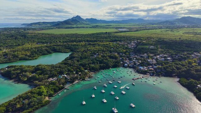 Scenic aerial drone video of the Trou d`Eau Douce resort, Mauritius, Africa. Indian ocean coral reef landscape	