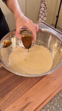 Pouring Coffee Mixture into Cake Batter, Adding Nescafe Flavor in Slow Motion Vertical Baking Process