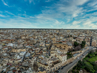 Fototapeta premium Aerial view of Bitonto: Home to the Pugliese Romanesque Cathedral, the Angevin Tower, and elegant stone palaces. Discover the City of Olives, Italy