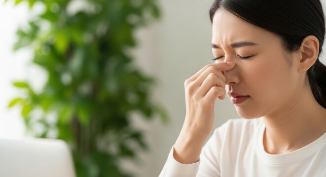 Eye problem concept, fatigue asian young woman tired eyes, irritated rubbing eye dry relief vision pain after work on laptop computer, eye strain, hand holding glasses, suffer migraine, bad blurry