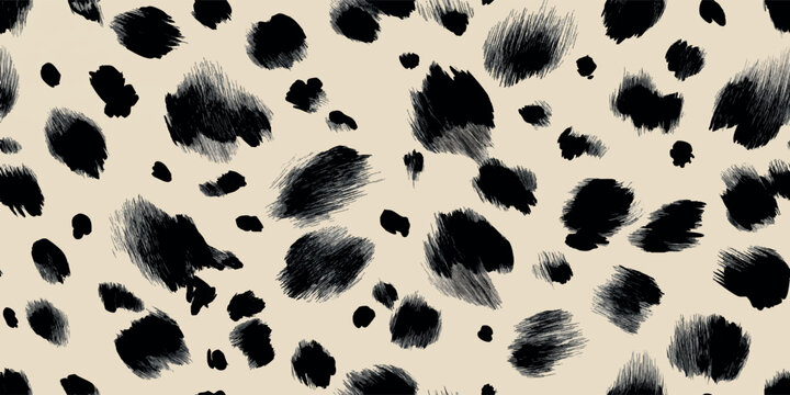 Hand drawn black ink leopard spots, polka dot on beige background for design, textiles, packaging, fabrics, and home decor wallpapers