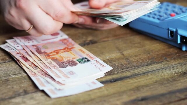 Person holding ruble banknotes