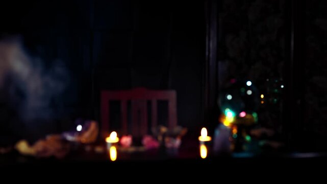 Mystical fortune telling scene with crystal ball candlelight smoke and bokeh in a dark room creating an esoteric ritual atmosphere for magic astrology and spirituality