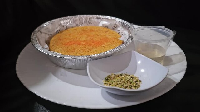 corn flakes with milk,Kunafeh,Kunafa,Knafeh Kunafi  is popular dessert in Middle east,Arabian,Turkiye,Greece,Balkan and Caucasus.Popular for Ramadan.It served with crushed pistachios and Attar