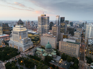Naklejka premium Aerial skyline of Montreal with Mary Queen of the World Cathedral and downtown skyscrapers at sunset, Quebec, Canada. g.