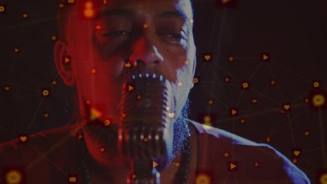 Vertical video: Cam moving in singer leaning to mic, icons overlaying, singing boosting music reach