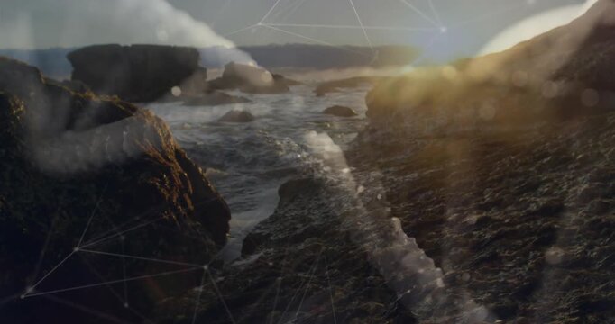 Rocky shore reacting to surf pushing into foam channel, sun glowing, mesh shifting for travel