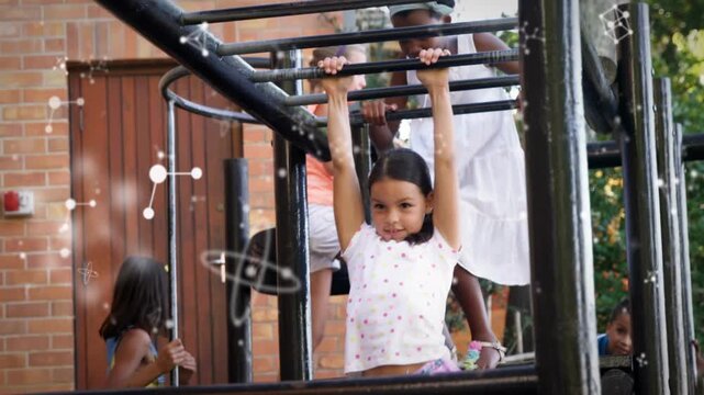 Girl gripping monkey bars and swinging legs, playing, causing educational molecule overlays