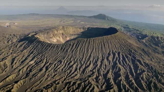 Travel and explore Vanuatu. Ambrym Island volcano with Benbow and Marum crater, showcasing the rugged volcanic landscape. Wild dramatic nature under cloudy sky. Aerial view drone flight panorama