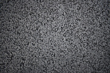 Fototapeta premium Close up texture of dark gray asphalt pavement.