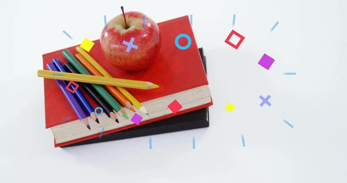 Notebooks apple pencils sitting on white table frames sending shapes passing over for school ad