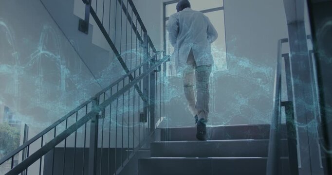 Dr climbing stairs to lab, stepping causing blue data ribbons growing around him, looking back