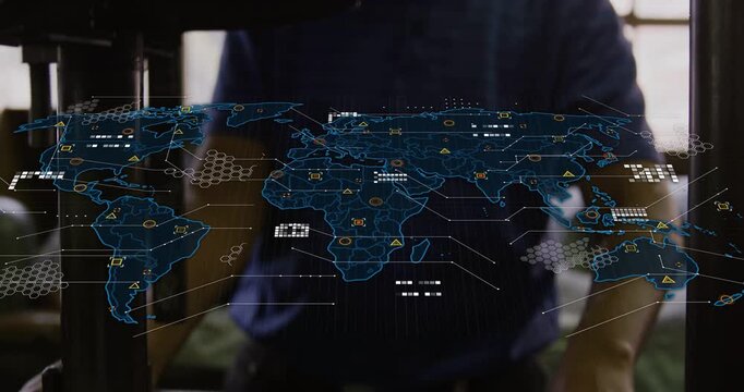 Manufacturing technician operating press, turning wheel and threading wire, initiating map overlay