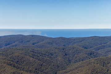High angle view across green agricultural pastures and rolling countryside in Barwon Downs Victoria © Brett Price