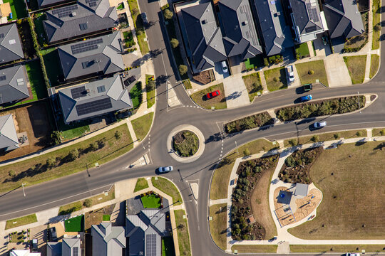 Aerial view of tightly packed grey residential rooftops in a modern suburban housing estate in Victoria Australia