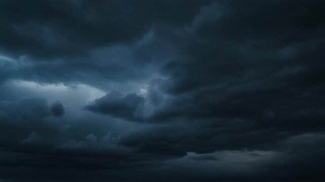 A dramatic stormy sky with dark clouds and lightning is brewing ominously outside.