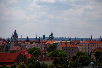 Obraz premium Prague skyline with red rooftops and church domes
