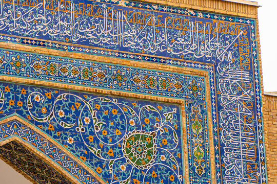 Facade of Gur-e-Amir - a mausoleum of the Asian conqueror Timur. Translation on mosque: Tamerlane. Famous travel destination in Uzbekistan