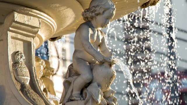 Close Up of Water Splashing from Carriedo Fountain Cherub Statue