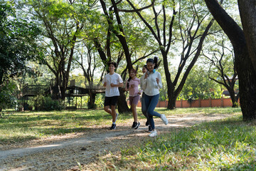Obraz premium Group of Asian people jogging at public park