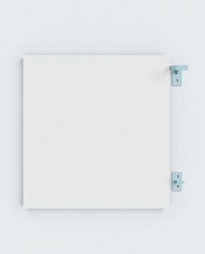 A white square object with blue metal brackets on a white wall