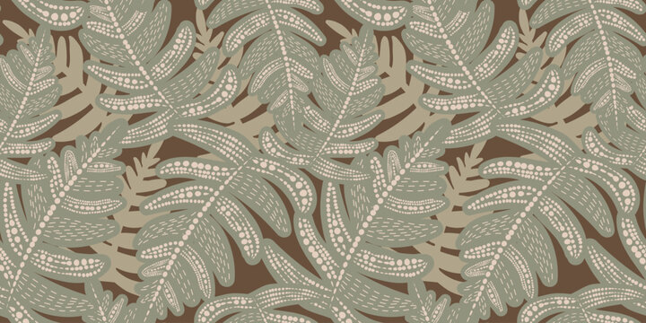 Seamless vector pattern with dotted fern leaf and tropical foliage. Ethnic botanical ornament with points on brown background for textile, wallpaper, and boho fashion print.