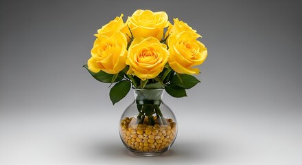 Fototapeta premium A vibrant bouquet of fresh yellow roses, artfully arranged in a clear glass vase filled with yellow