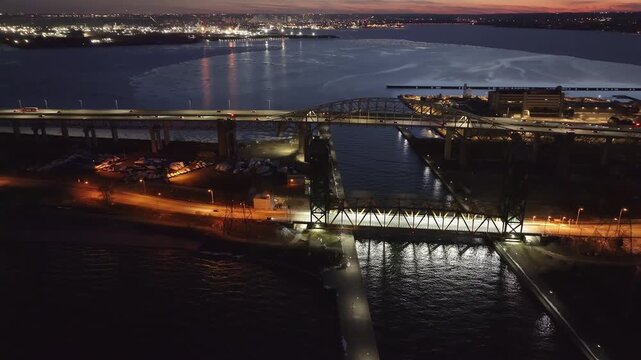 Aerial night view of skyway bridge, Hamilton Harbour, and city lights