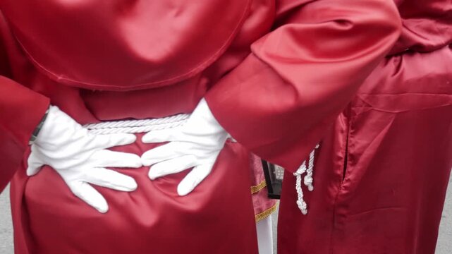 Easter celebration in Alicante, Spain with robes and white gloves
