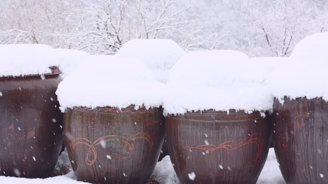 Close Up of Snow Capped Korean Onggi Jars