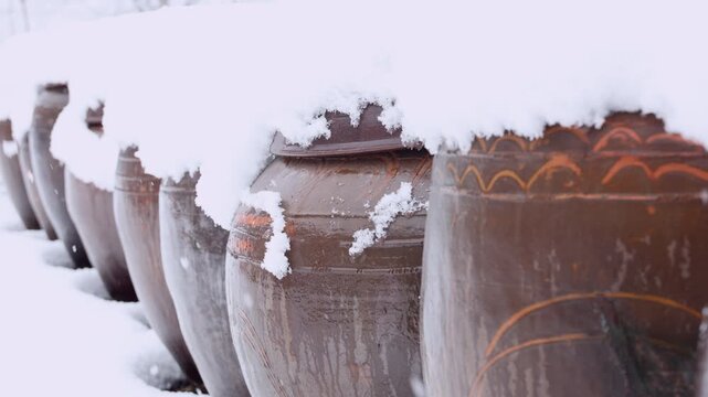 Diagonal Row of Snow Covered Korean Onggi Jars