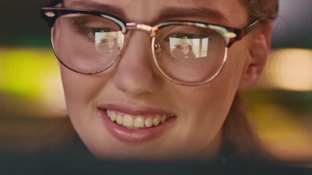 Glasses, talk or happy woman on video call at night, online discussion or virtual contact for bonding. Tech reflection, neon lights or long distance friends with late chat in home, specs or blow kiss