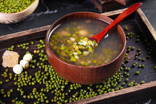 Fresh Mung Bean Soup in Wooden Bowl with Green Beans and Lotus Seeds