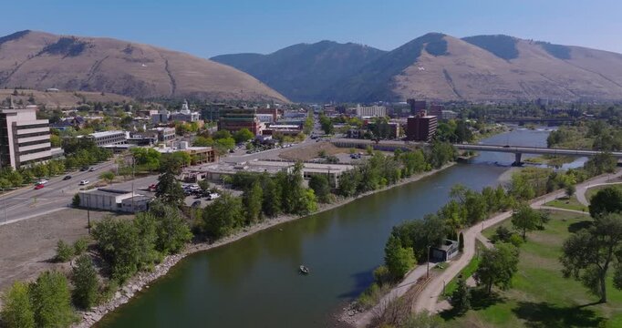 Aerial descend of Missoula Montana Clark Fork River and downtown skyline in backdrop