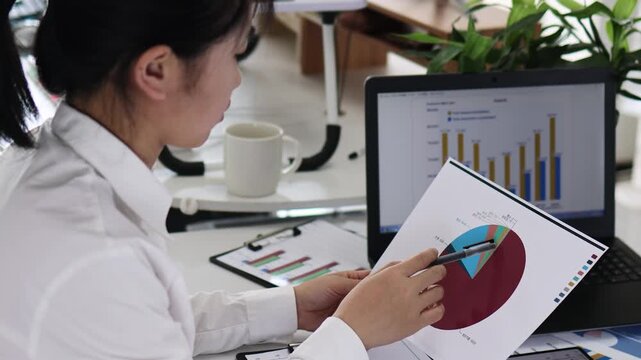 Office workers doing data analysis and financial planning