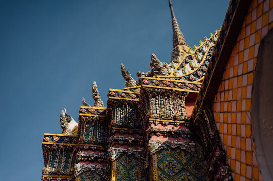 Ornate temple roof detail with mosaic tiles at Grand Palace Bangkok