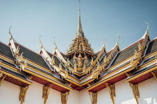 Symmetrical temple roof and central spire at Grand Palace Bangkok