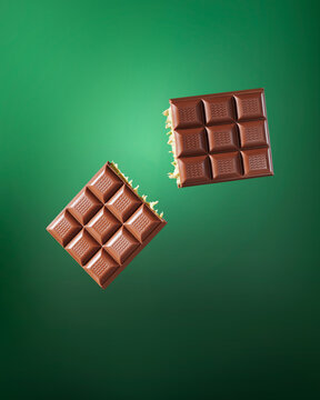 levitating chocolate on green background