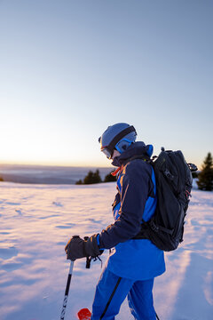 Male skier looking towards the morning sun