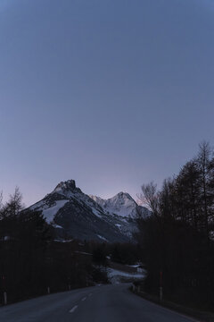 Alpine landscape with a mountain at dusk