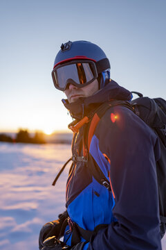 Portrait of a skier at sunrise in the Alps