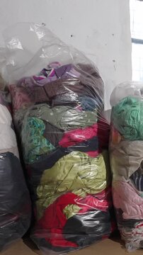 Baled used kids clothing for recycling and reuse
