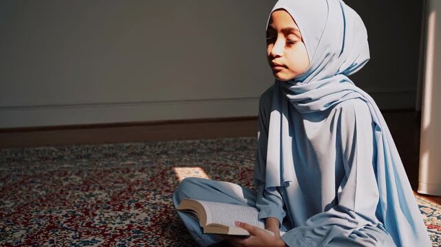 Devout Lady Studying Sacred Scripture. Contemplative Muslim Woman In Modest Dress Engaging Spiritually. Serene Young Woman Dressed In Hijab Deeply Immersed In Prayer And Scriptural Reading