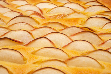 Apple slices on a tart or pie, side view close up © Dorin