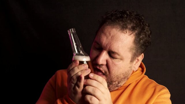Alcohol addicted man drinking beer