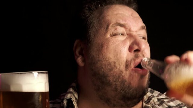 Alcohol addicted man drinking beer